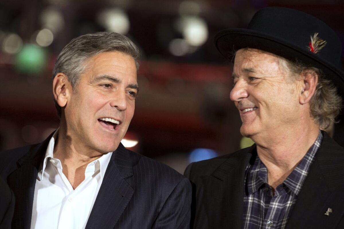 George Clooney, left, and Bill Murray arrive for the screening of the film "The Monuments Men" at the Berlin Film Festival on Saturday.