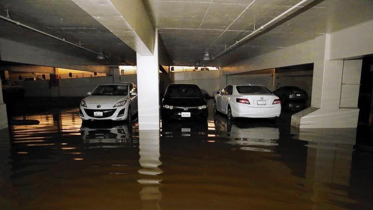 An estimated 900 vehicles are marooned in two parking garages at UCLA. Some were removed Thursday night.
