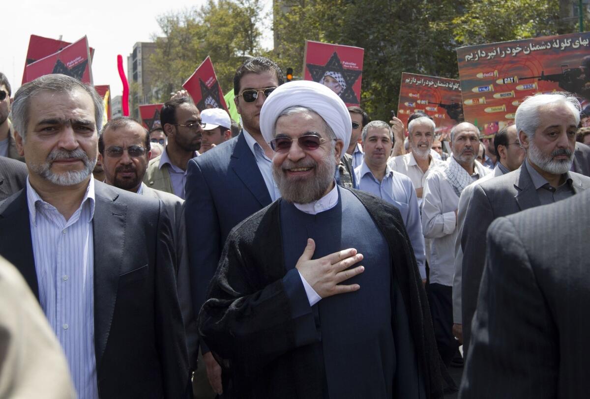 Iranians and Americans hopeful of better relations between their two countries will be closely following the visit next week to the U.N. General Assembly of Iranian President Hassan Rouhani, center, who has turned a more pleasant face to the West since his inauguration last month.