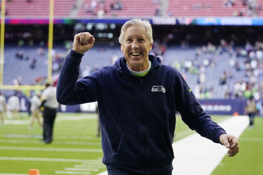 Seattle Seahawks head coach Pete Carroll reacts to fans after their win over the Houston Texans in an NFL football game, Sunday, Dec. 12, 2021, in Houston. (AP Photo/Eric Christian Smith)