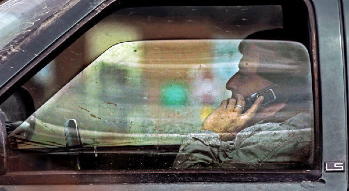 A driver talks on the phone in Montpelier, Vt.