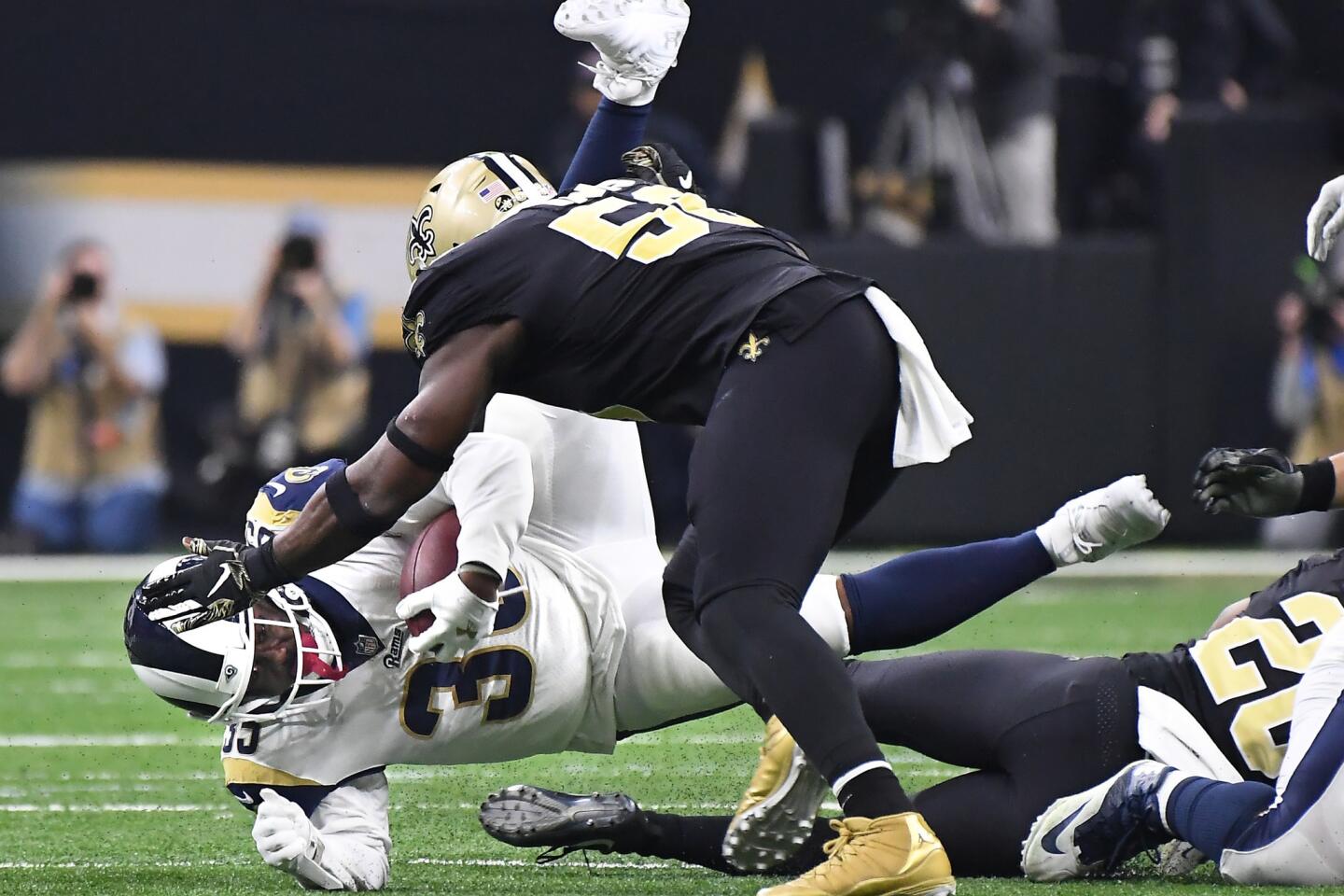 Rams running back C.J. Anderson is upended by the New Orleans Saints defense in the third quarter in the NFC Championship at the Superdome in New Orleans Sunday.