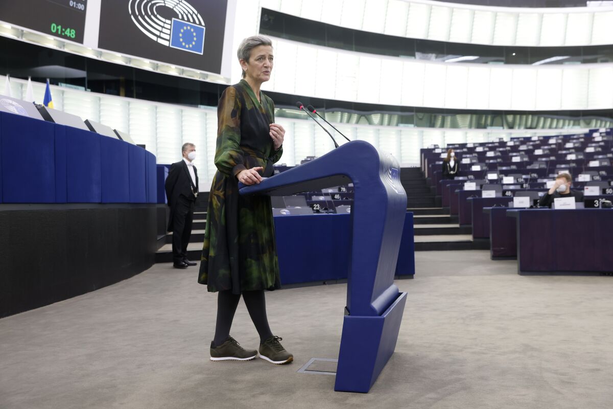 European Commissioner for Europe fit for the Digital Age Margrethe Vestager delivers her speech during a debate on the Digital Markets act at the European Parliament in Strasbourg, eastern France, Tuesday, Dec.14, 2021. The European Union’s ambitious plan to update its pioneering internet rules gained momentum Tuesday, after a key committee passed measures requiring technology companies to better police content and lawmakers prepared to vote on regulations to rein in Big Tech. (AP Photo/Jean-Francois Badias, Pool)