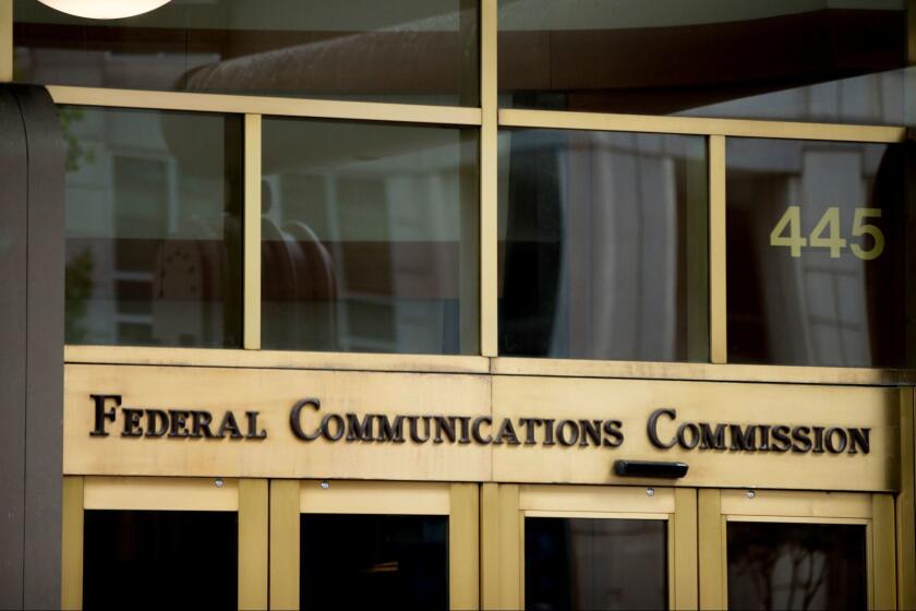 FILE - This June 19, 2015, file photo, shows the Federal Communications Commission building in Washington. On Tuesday, April 25, 2017, an appeals court upheld "net neutrality" rules that treat the internet like a public utility and prohibit blocking, slowing and creating paid fast lanes for online traffic. They have been in effect for a year. The ruling cements the FCC's authority to regulate the internet more strictly. The agency has already proposed making it harder for broadband providers to use consumer data for advertising purposes. (AP Photo/Andrew Harnik, File)