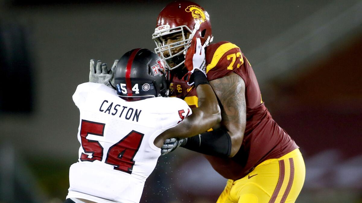 UCS offensive tackle Zach Banner blocks against Arkansas State defensive end Caleb Caston on Sept. 5.