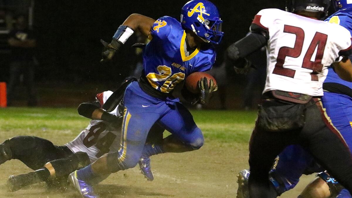Bishop Amat running back Torreahno Sweet fights for yards in the first quarter of a Southern Section Pac-5 Division quarterfinal game against Oaks Christian on Friday night.