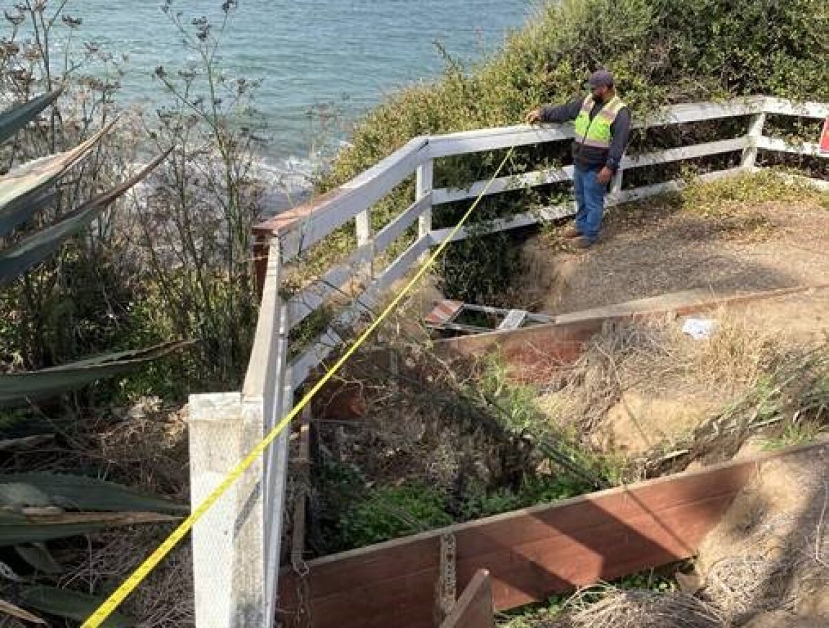 Crews work to reduce flooding and erosion at the edge of La Jolla Hermosa Park.