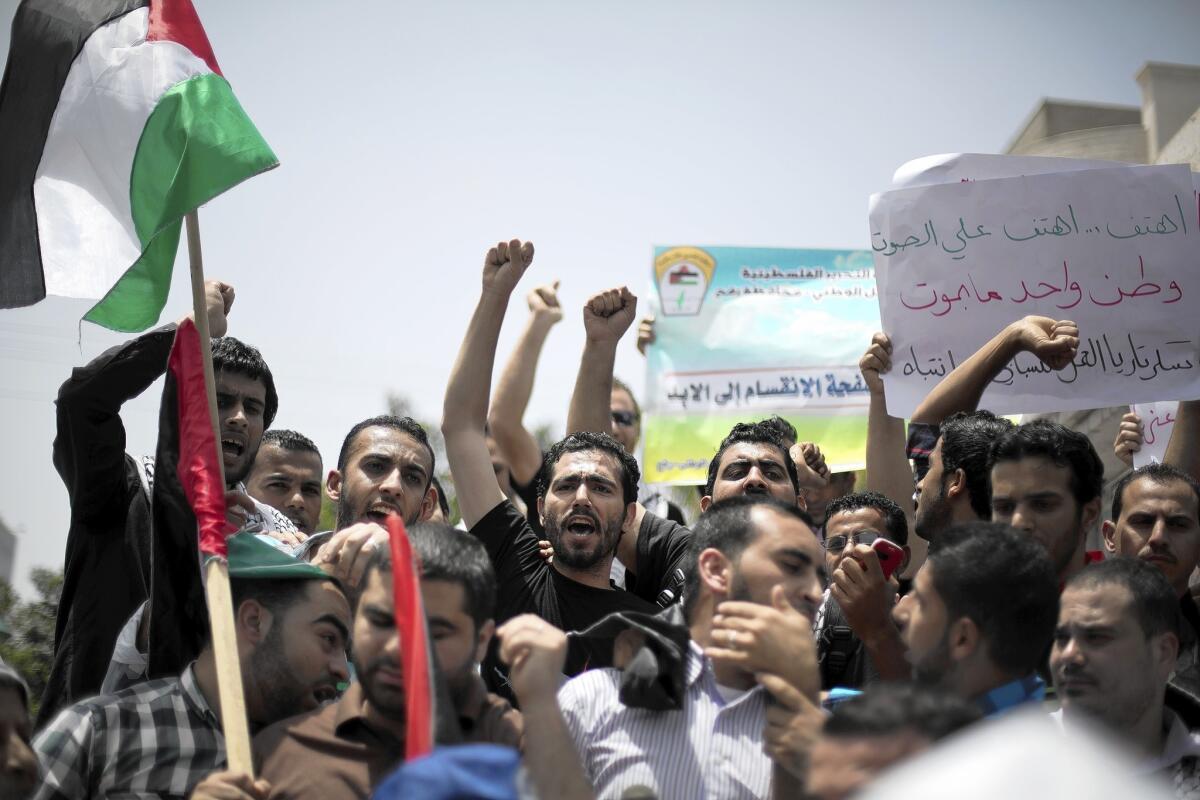 Palestinians call for the formation of a unity government during a rally May 27 in Gaza City.