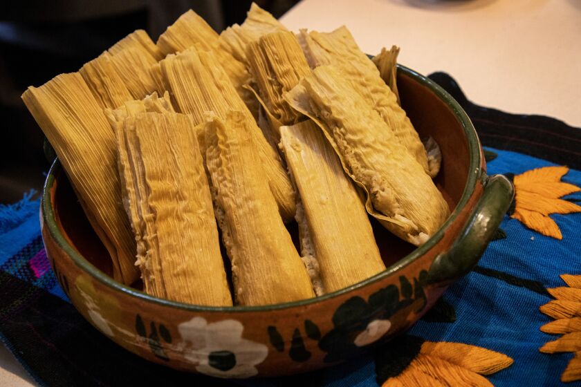 Vegetable tamales set out for guests. Avila has stuffed them with butternut squash, tomatillos and Roma tomatoes, chiles and cheese.