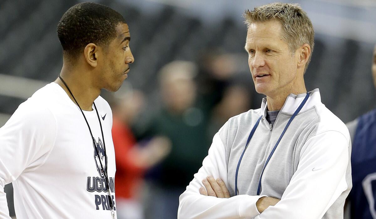 Then television analysts Steve Kerr, right, chats with Connecticut Coach Kevin Ollie before a Final Four game.