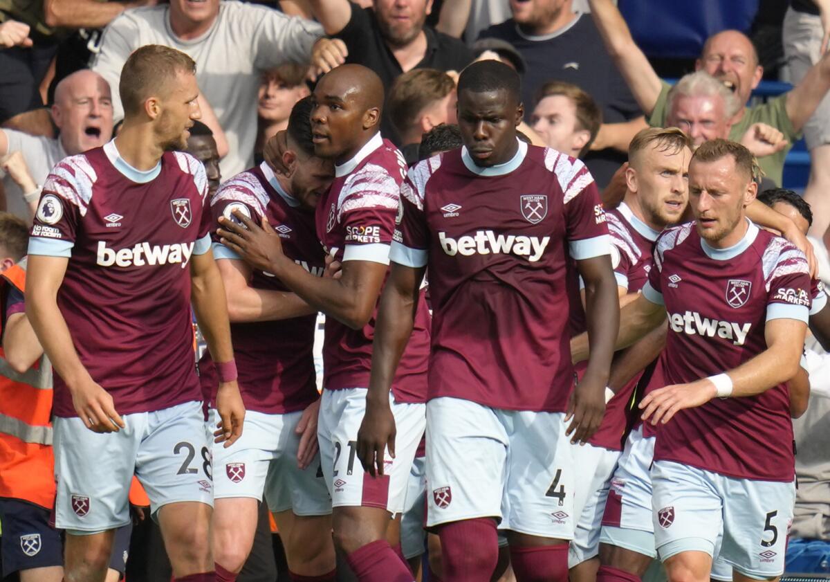 West Ham players celebrate after scores a disallowed goal during the English Premier League soccer match between Chelsea and West Ham United at Stamford Bridge Stadium in London, Saturday, Sept. 3, 2022. (AP Photo/Kirsty Wigglesworth)