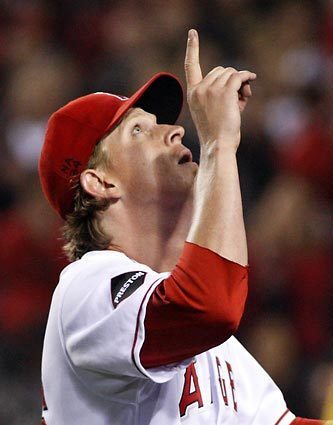 Angels starting pitcher Jered Weaver gestures skyward in memory of Nick Adenhart after getting relieved in the seventh inning Friday.