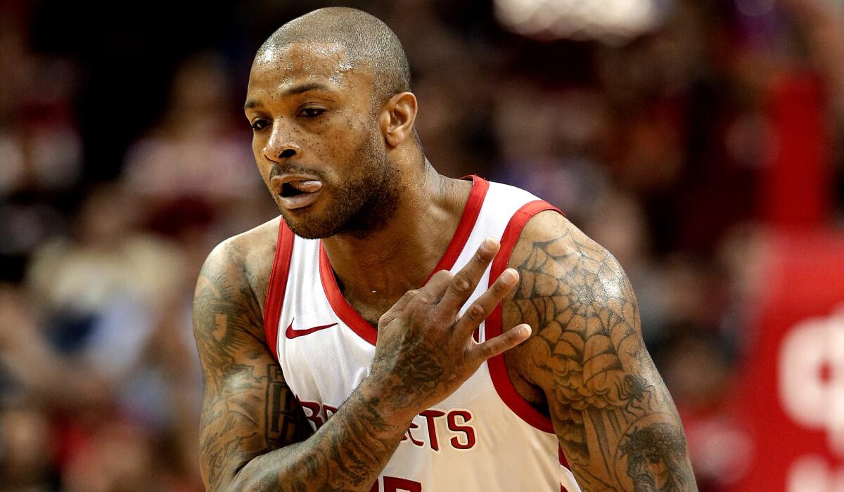Rockets forward P.J. Tucker reacts after sinking a three-point shot against the Nuggets on Jan. 7.