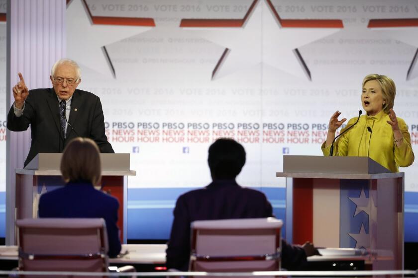 Candidates Sen. Bernie Sanders and Hillary Clinton argue a point during the Democratic presidential primary debate at the University of Wisconsin-Milwaukee.
