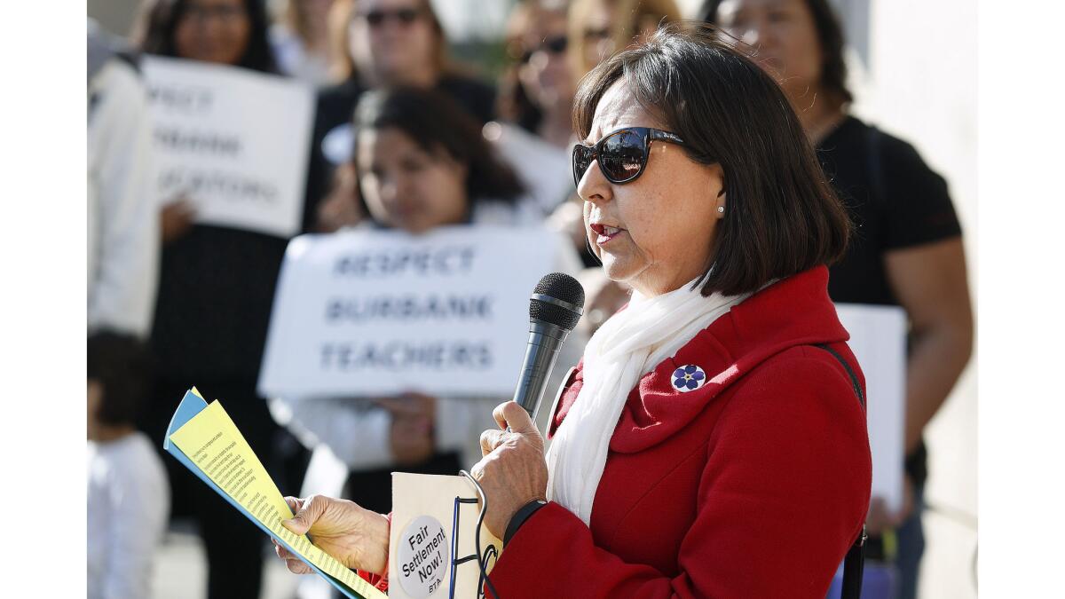 Burbank Teachers Association President Diana Abasta talks with the members who gathered at Burbank High School on Thursday. Members of the Burbank Teachers Association marched from Burbank High School to Burbank City Hall to protest for better pay.