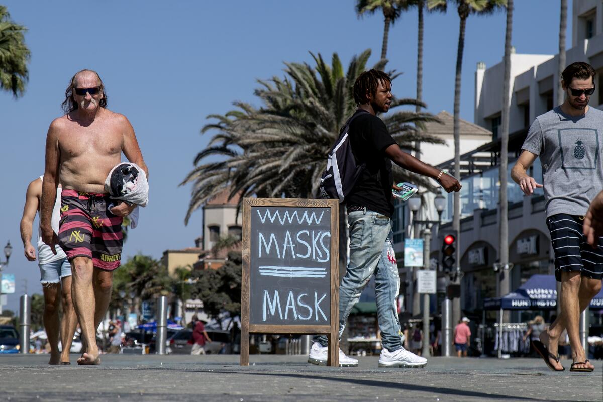 People walking in Huntington Beach