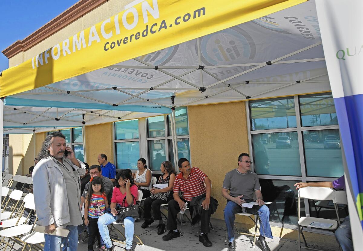 People wait to sign up for Obamacare at AltMed Health Services in Los Angeles in February.