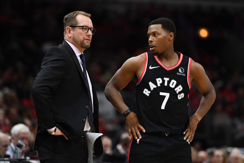 Raptors coach Nick Nurse and point guard Kyle Lowry talk during a break in play against the Chicago Bulls on Oct. 26, 2019.