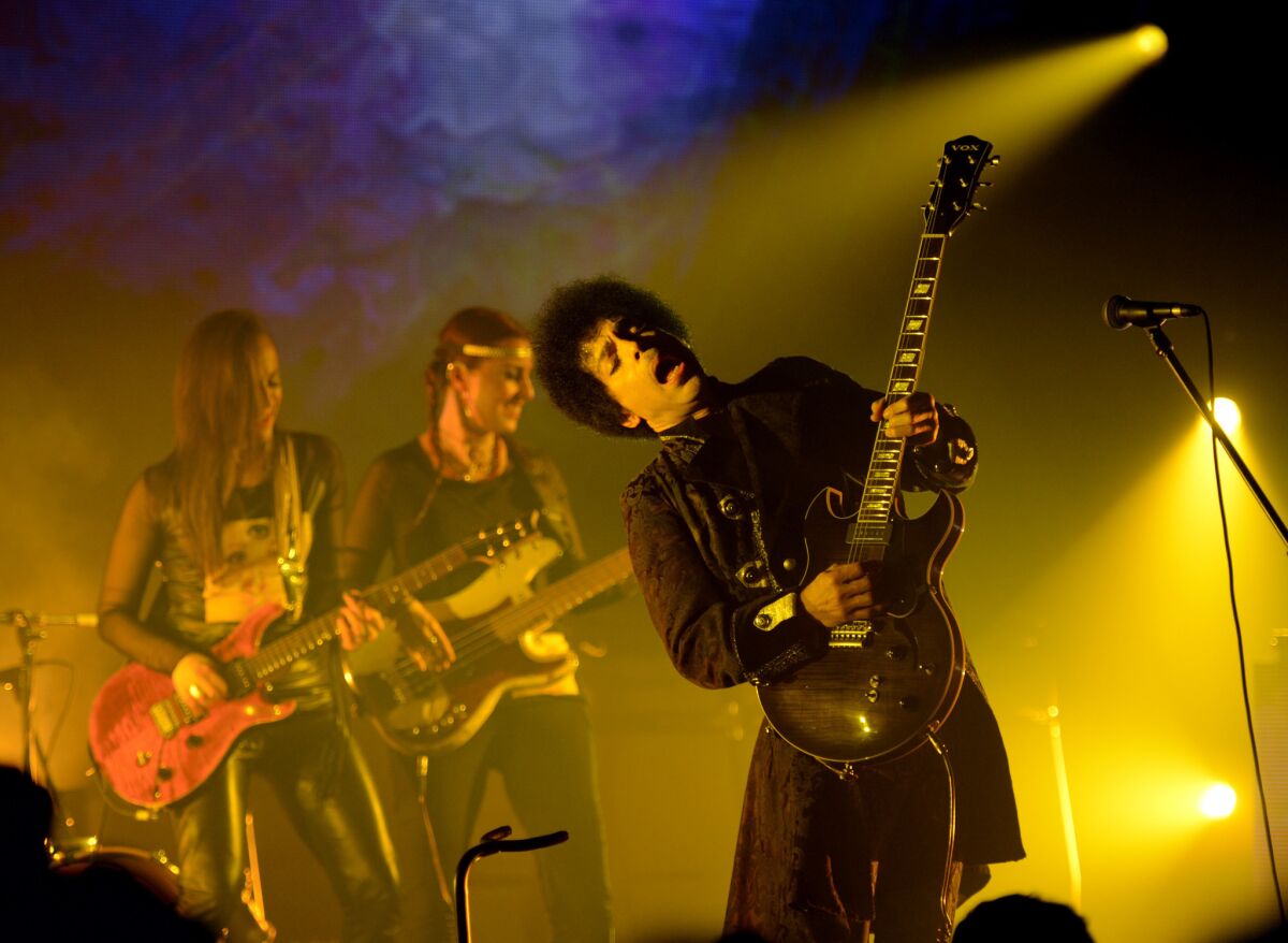 Prince and his band 3rd Eye Girl perform at the Vogue Theatre in Vancouver, Canada, on April 15, 2013.