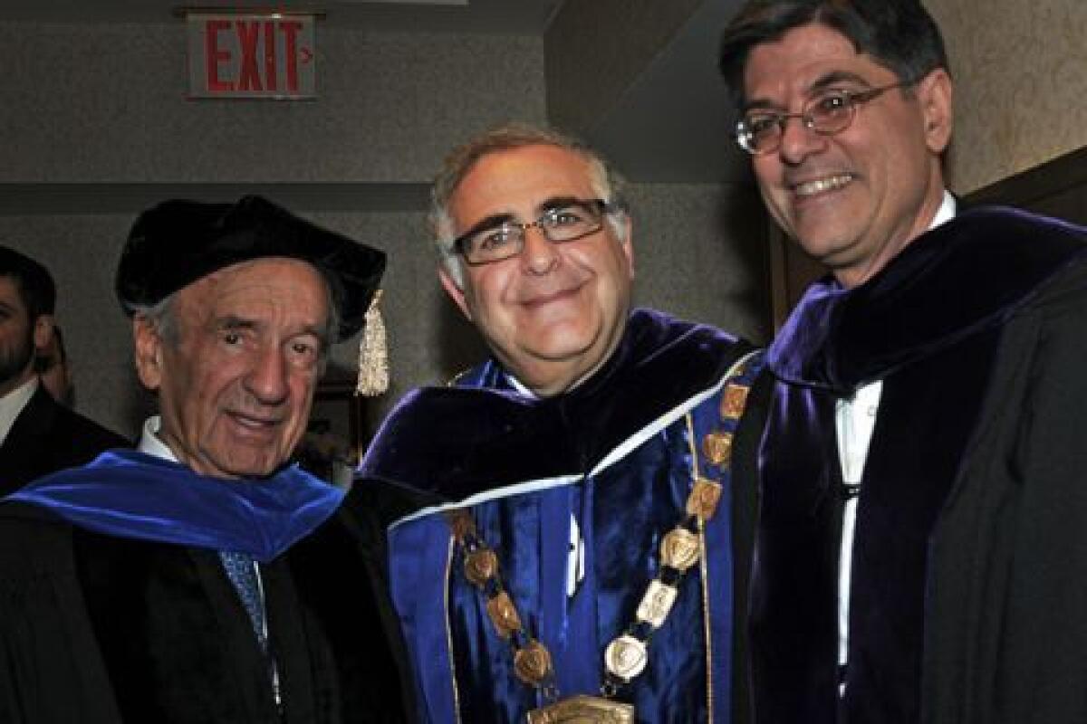 Nobel laureate Elie Wiesel, left, and then-White House budget chief Jacob J. Lew flank Yeshiva University President Richard Joel at a 2012 convocation.