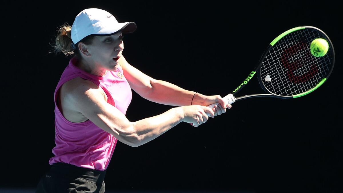 Simona Halep of Romania plays a shot during a practice session at Melbourne Park ahead of the Australian Open.