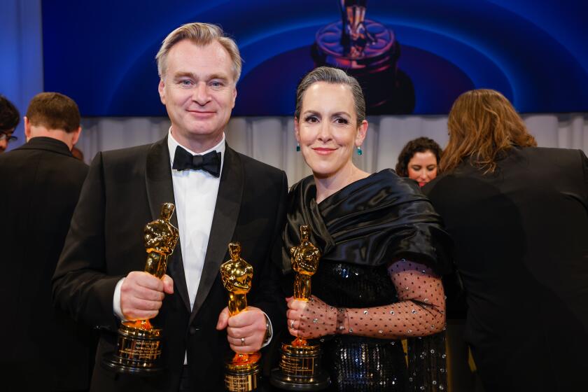 Hollywood, CA - March 10: Christopher Nolan and Emma Thomas at the 96th Annual Academy Awards Governor's Ball located in the Ray Dolby Ballroom on the top level of Ovation Hollywood in Hollywood, CA, Sunday, March 10, 2024. (Jason Armond / Los Angeles Times)