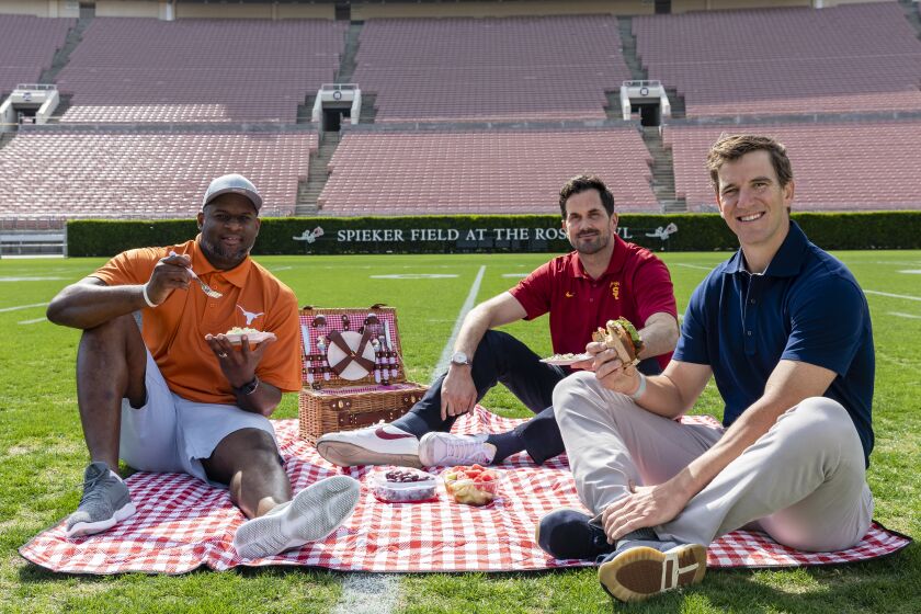 Vince Young, Matt Leinart and Eli Manning have a picnic on the Rose Bowl field.