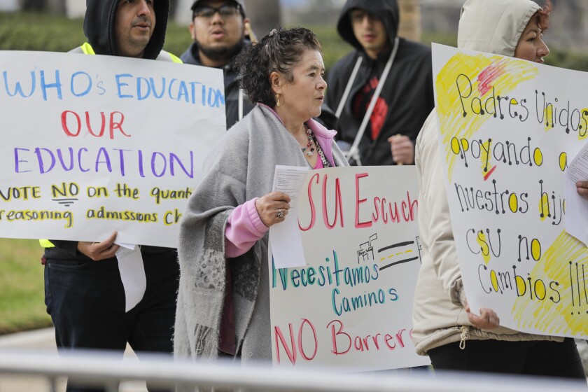 Protesters carrying signs