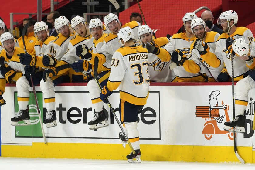 Nashville Predators right wing Viktor Arvidsson (33) celebrates scoring on a penalty shot against the Detroit Red Wings in the third period of an NHL hockey game Thursday, April 8, 2021, in Detroit. (AP Photo/Paul Sancya)