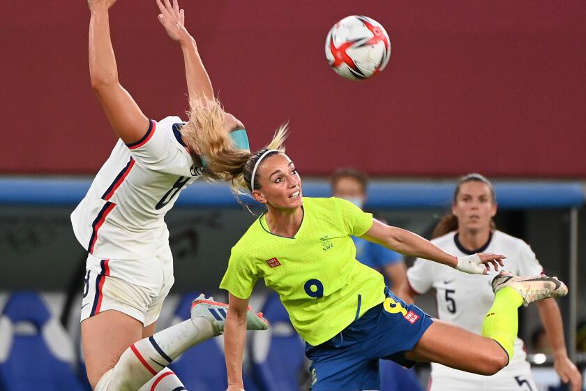 -SP- July 21, 2021: USA's Julie Ertz battles for the ball wit Sweden's Kosovare.