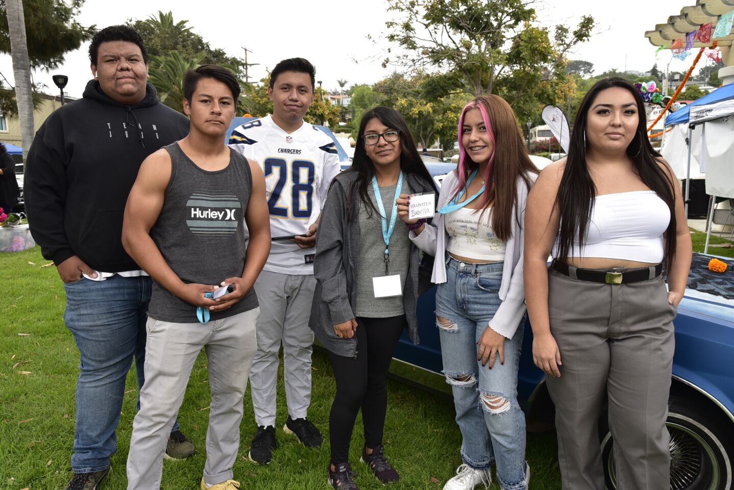 Teens participating in the Dia de los Muertos at La Colonia