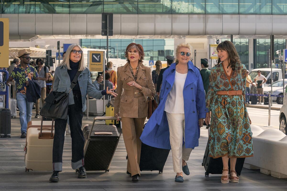  Diane Keaton, Jane Fonda, Candice Bergen and Mary Steenburgen pull luggage in an airport for a movie scene