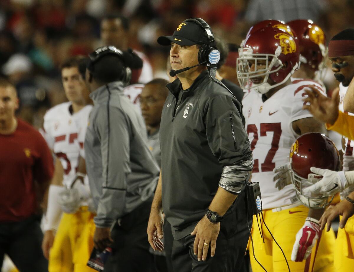USC Coach Steve Sarkisian watches from the sideline during the Trojans' game against Arizona on Oct. 11, 2014.
