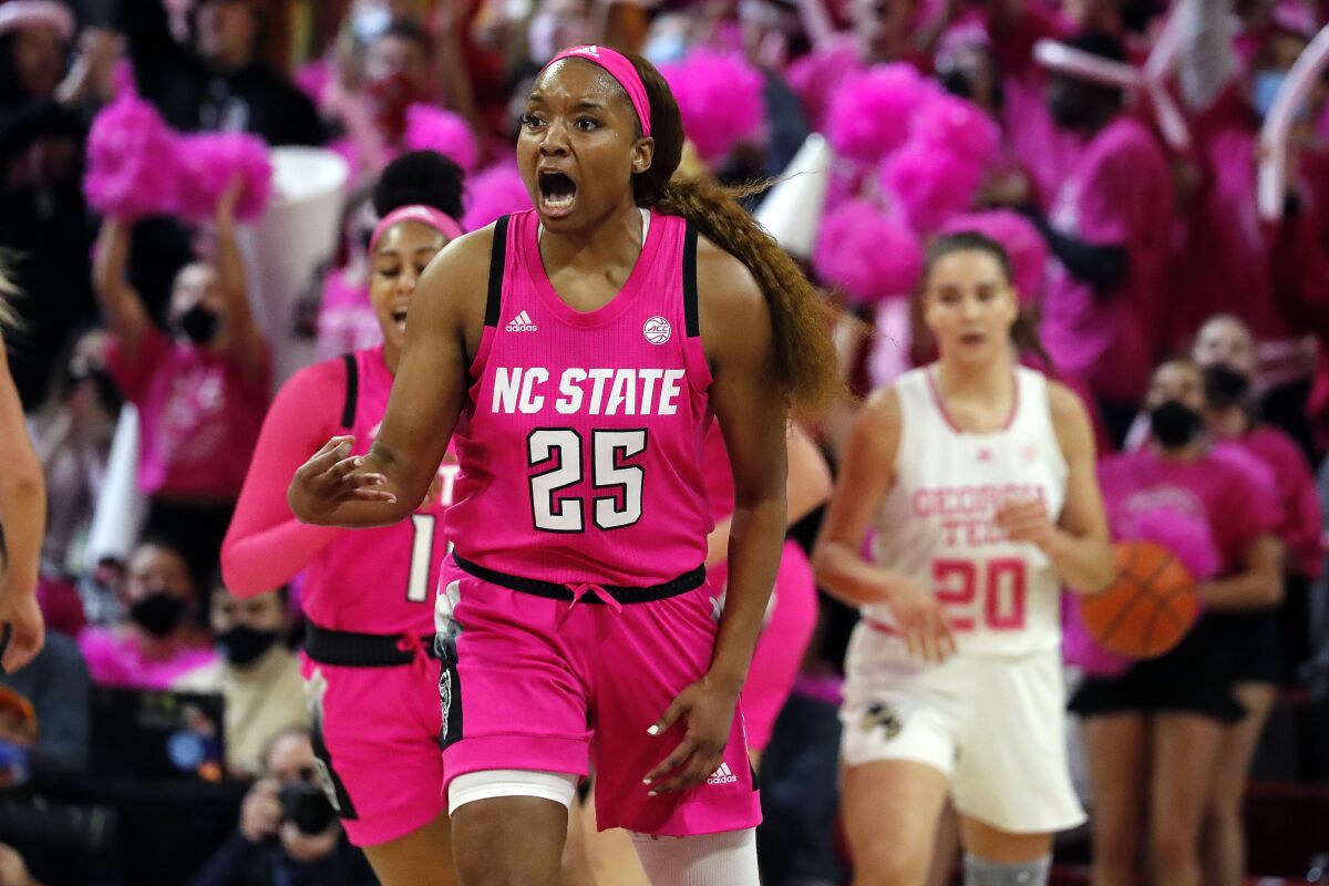 North Carolina State's Kayla Jones (25) reacts after scoring a 3-point shot against Georgia Tech during the first half of an NCAA college basketball game, Monday, Feb. 7, 2022, in Raleigh, N.C. (AP Photo/Karl B. DeBlaker)