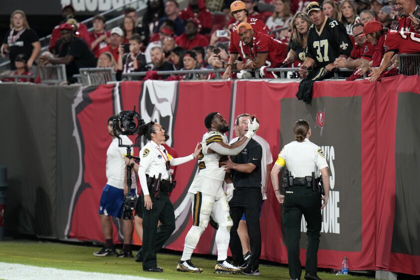 New Orleans Saints running back Mark Ingram II (22) reacts as he is heckled by fans while walking to the locker room in the second half of an NFL football game against the Tampa Bay Buccaneers in Tampa, Fla., Monday, Dec. 5, 2022. The Buccaneers won 17-16. (AP Photo/Chris O'Meara)