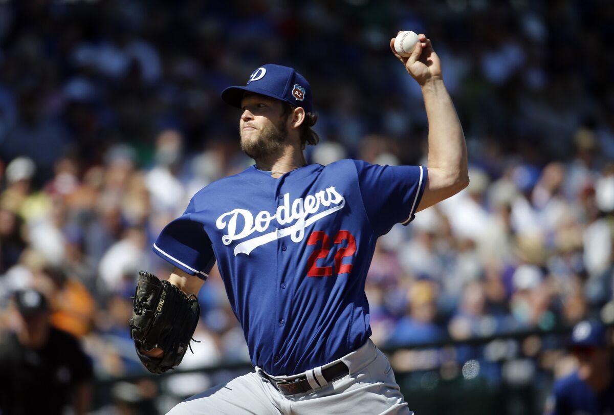 Dodgers starting pitcher Clayton Kershaw throws during the first inning of a spring training game against the Cubs.