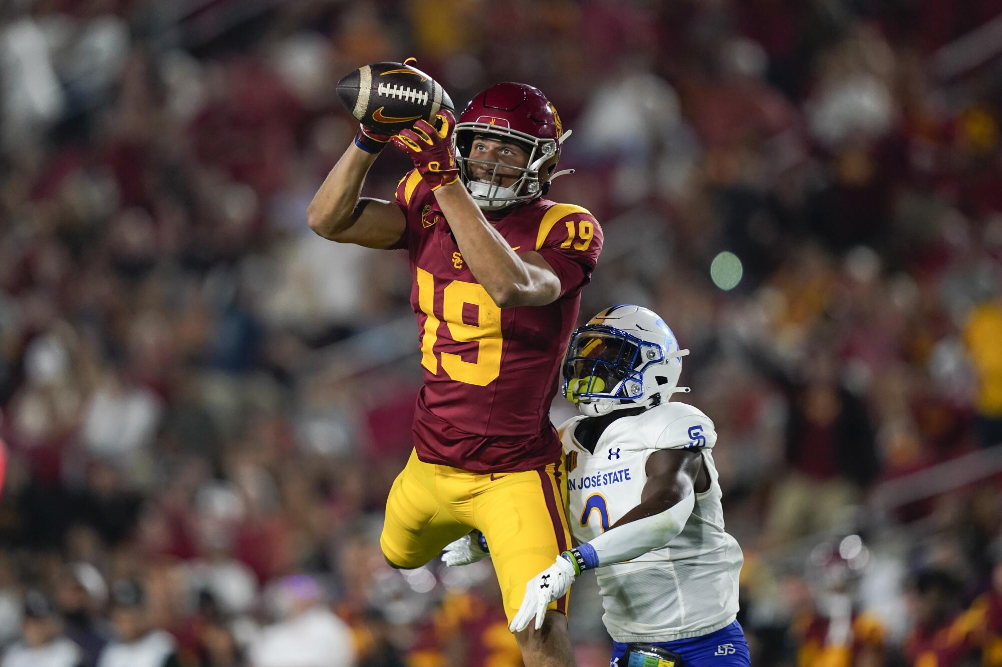 Duce Robinson catches a pass for USC.