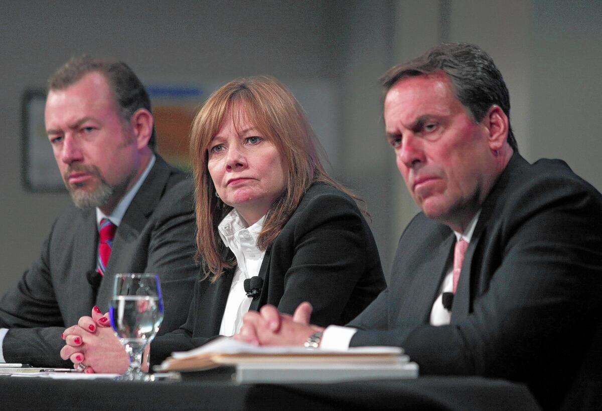GM Chief Executive Mary Barra, flanked by Executive Vice President Mark Reuss, left, and President Dan Ammann, discusses GM's report on its defective ignition switch in June, 2014.