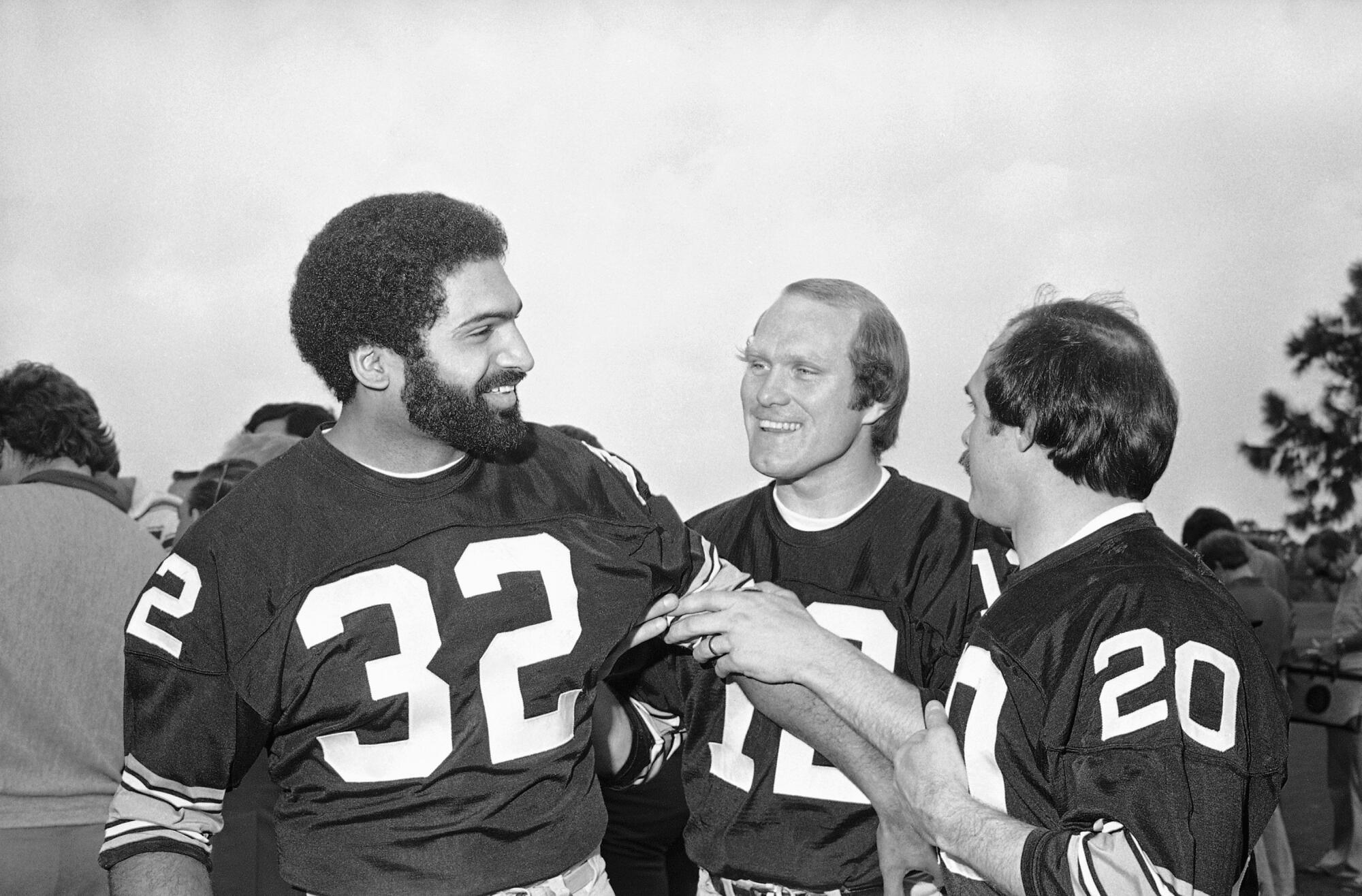 Steelers quarterback Terry Bradshaw and running back Franco Harris joke around before the Super Bowl in 1979 