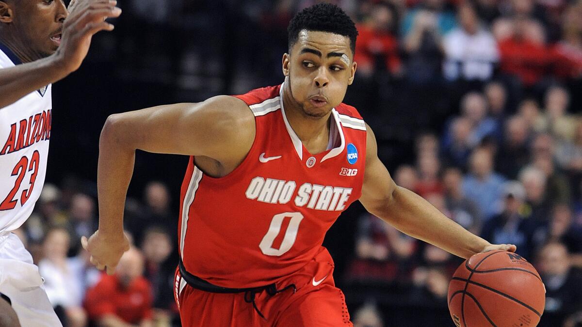 Ohio State point guard D'Angelo Russell drives to the basket during a loss to Arizona in the NCAA tournament on March 21, 2015. Russell is considered one of the top point guards available in this year's NBA draft.