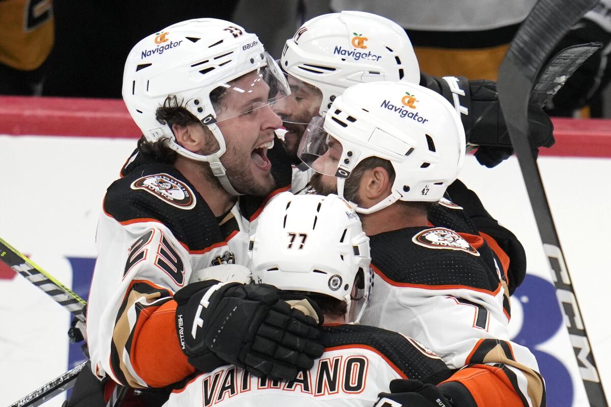 Ducks forward Mason McTavish, left, celebrates after scoring during the third period against the Penguins.