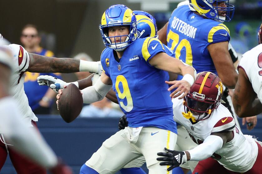 Inglewood, California December 17, 2023-Rams quarterback Matthew Stafford scrambles.