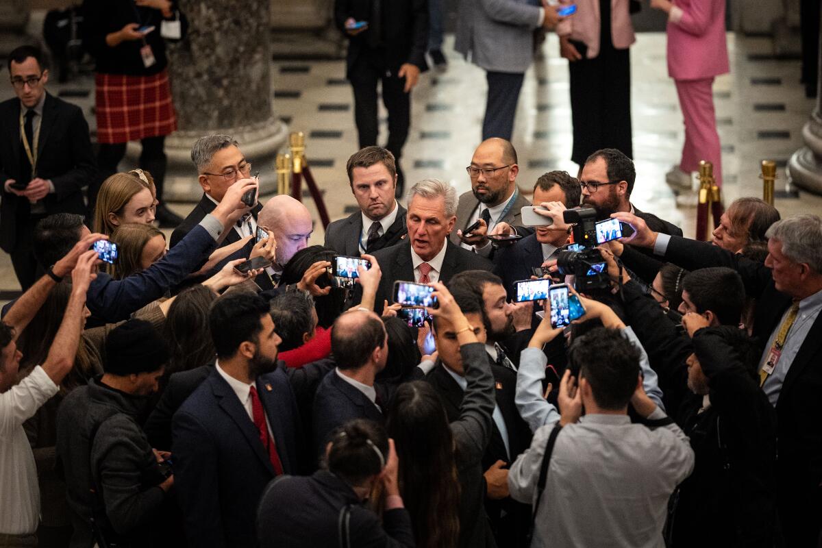 Kevin McCarthy speaks to a large group of journalists