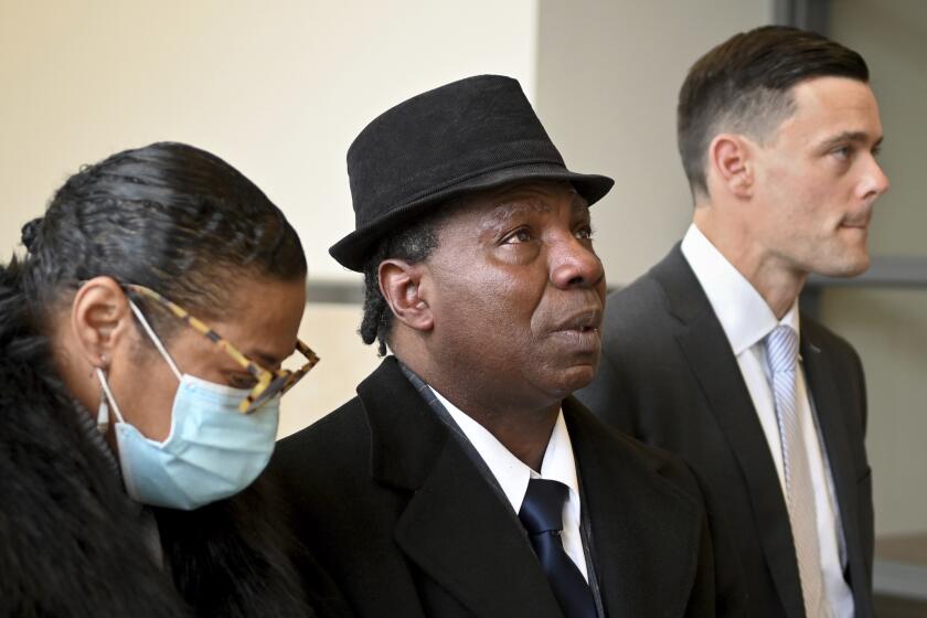 FILE - Anthony Broadwater, 61, center, appears after a judge overturned his conviction that wrongfully put him in state prison for the rape of author Alice Sebold, Nov. 22, 2021, in Syracuse, N.Y. Sebold apologized to Broadwater on Tuesday and said she was struggling with the role she unwittingly played "within a system that sent an innocent man to jail." Her 1981 rape was the basis for her memoir "Lucky." (Katrina Tulloch/The Post-Standard via AP, File)