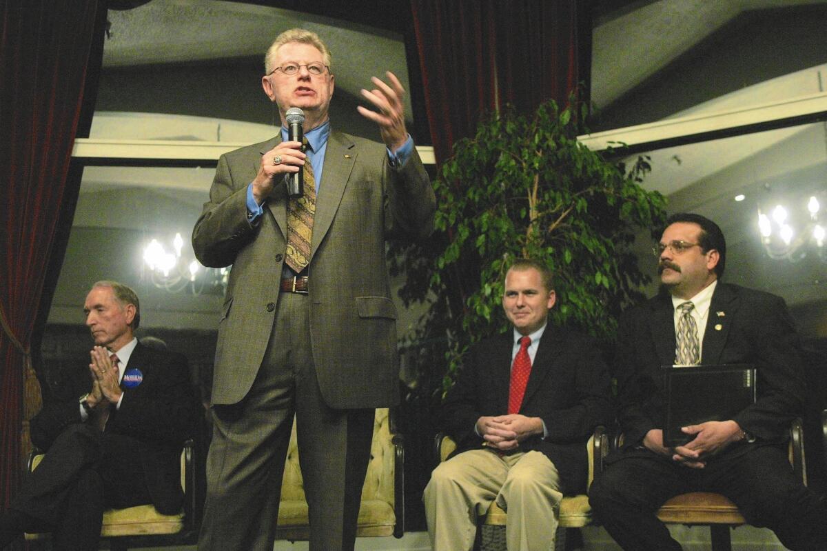 Then-San Bernardino City Attorney Jim Penman speaks at a candidates' forum in 2005 during an unsuccessful run for mayor. Penman is flanked by the eventual winner, Patrick Morris, left, Chas Kelley and Rick Avila, right.