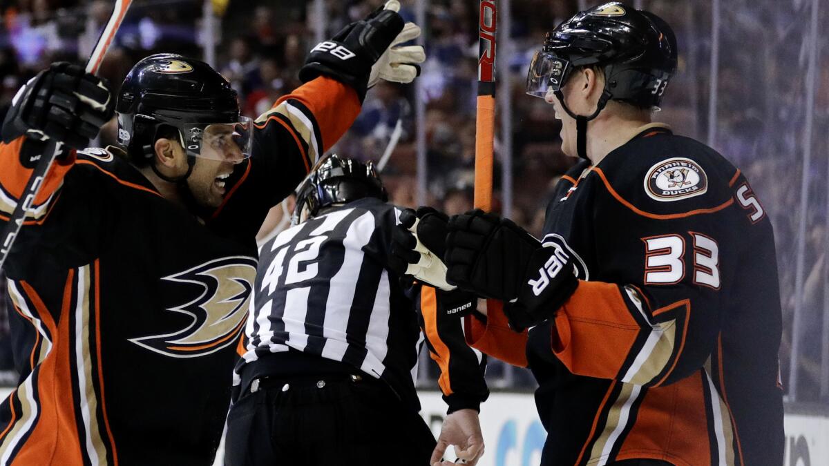 Ducks forward Jakob Silfverberg (33) celebrates his goal with teammate Andrew Cogliano during the second period Friday night.
