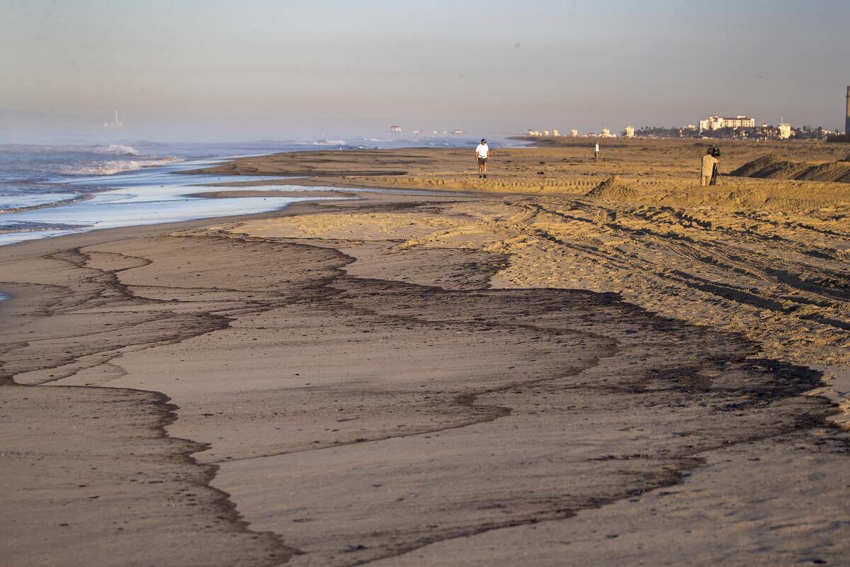 An oil slick washes up on Huntington State Beach 