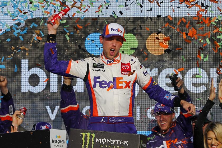 AVONDALE, ARIZONA - NOVEMBER 10: Denny Hamlin, driver of the #11 FedEx Ground Toyota, celebrates in Victory Lane after winning the Monster Energy NASCAR Cup Series Bluegreen Vacations 500 at ISM Raceway on November 10, 2019 in Avondale, Arizona. (Photo by Jonathan Ferrey/Getty Images)