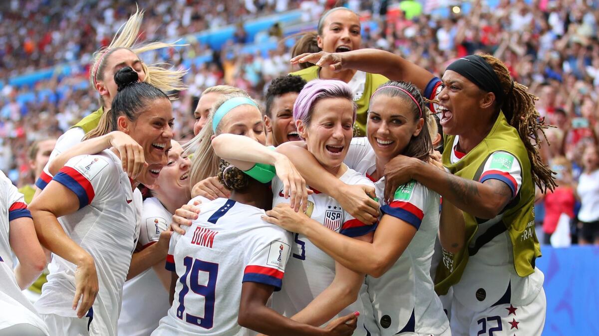 Megan Rapinoe celebrates with her U.S. teammates Sunday following their 2-0 victory over the Netherlands in the Women's World Cup final in Lyon, France.