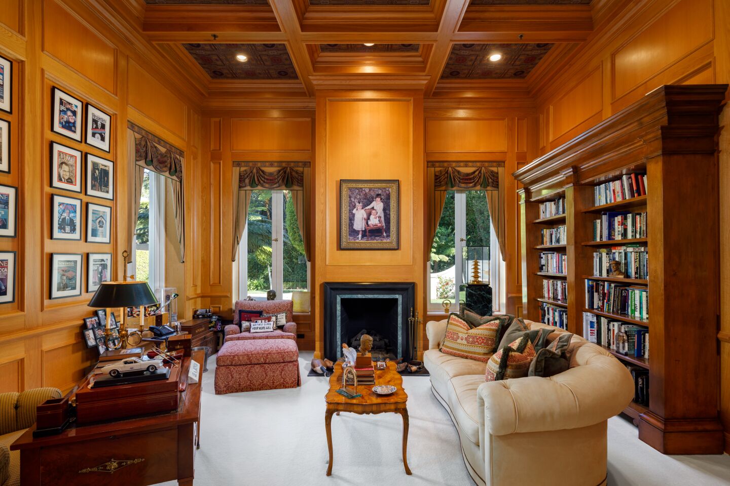 The wood-paneled den.